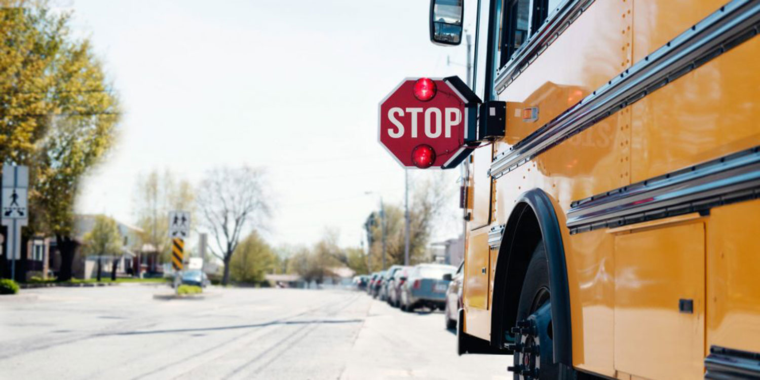 School bus stopped in a neighborhood.